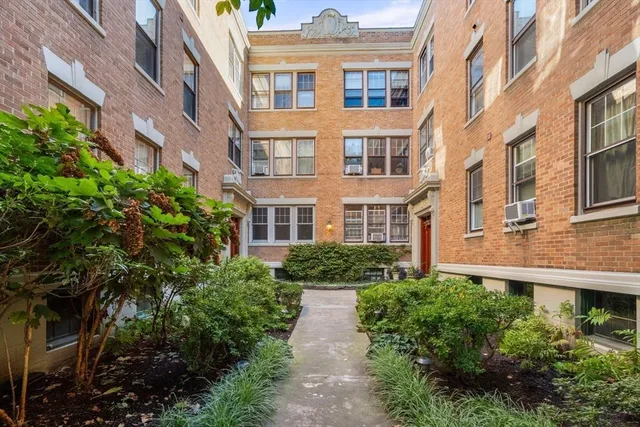 a view of a building with a garden