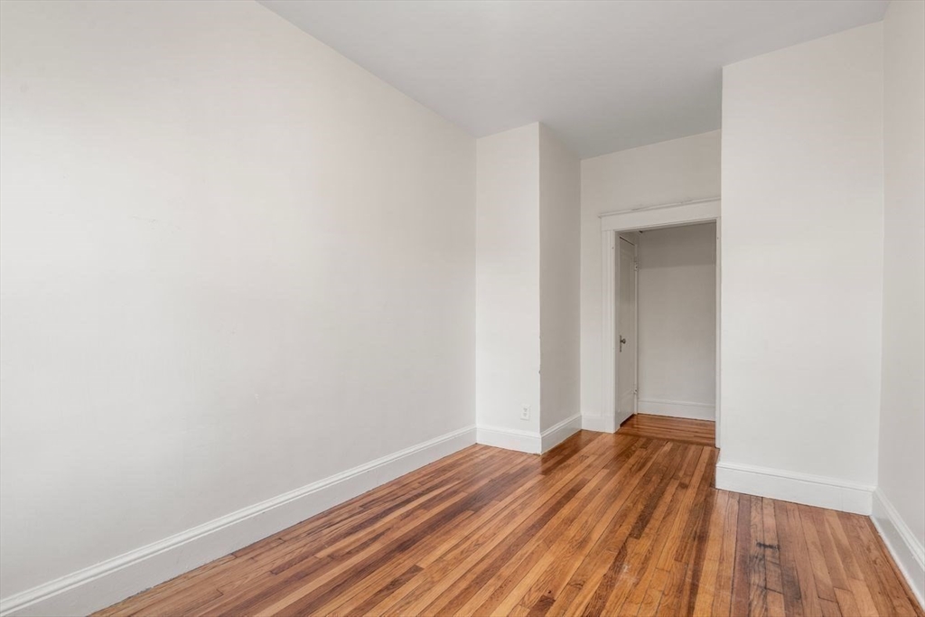 441 Washington Street, Unit 2 Brookline, MA 02446 - Photo 19 of 28 a view of a room with wooden floor