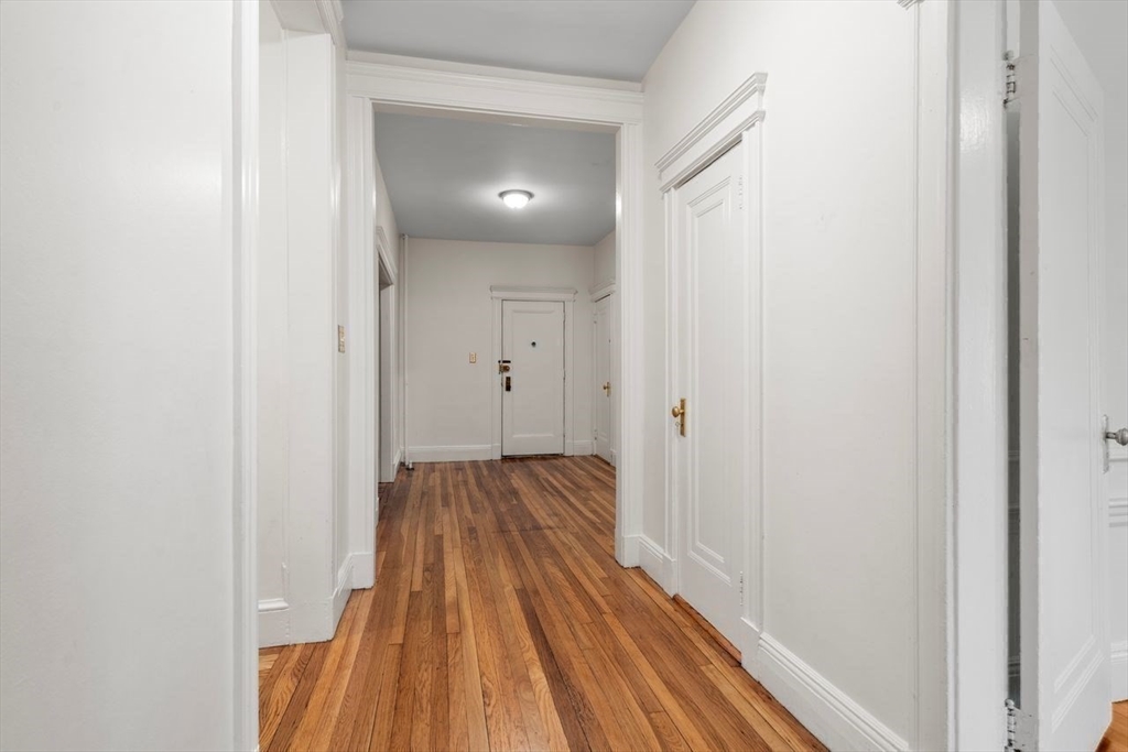 441 Washington Street, Unit 2 Brookline, MA 02446 - Photo 21 of 28 a view of a room with wooden floor and a bathroom