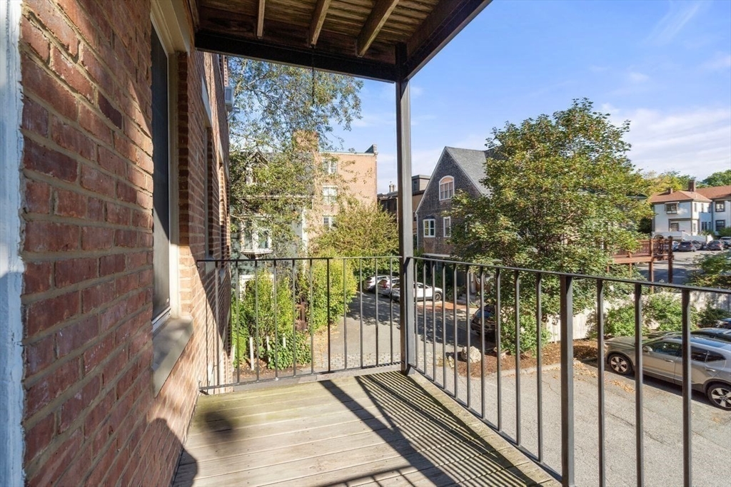 441 Washington Street, Unit 2 Brookline, MA 02446 - Photo 23 of 28 a view of a balcony with wooden floor