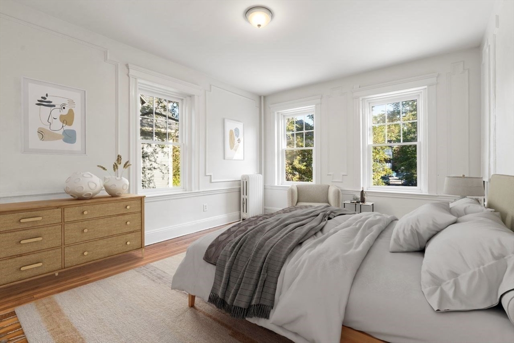 441 Washington Street, Unit 2 Brookline, MA 02446 - Photo 5 of 28 a bedroom with a bed and a window