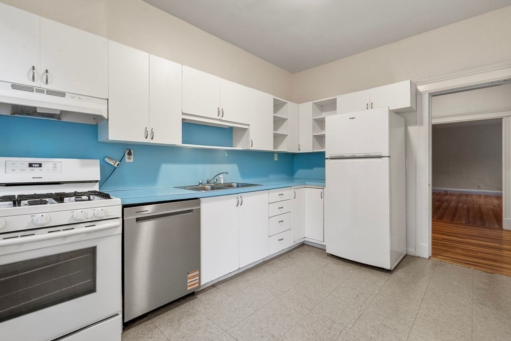 441 Washington Street, Unit 2 Brookline, MA 02446 - Photo 10 of 28 a kitchen with cabinets appliances and a counter space