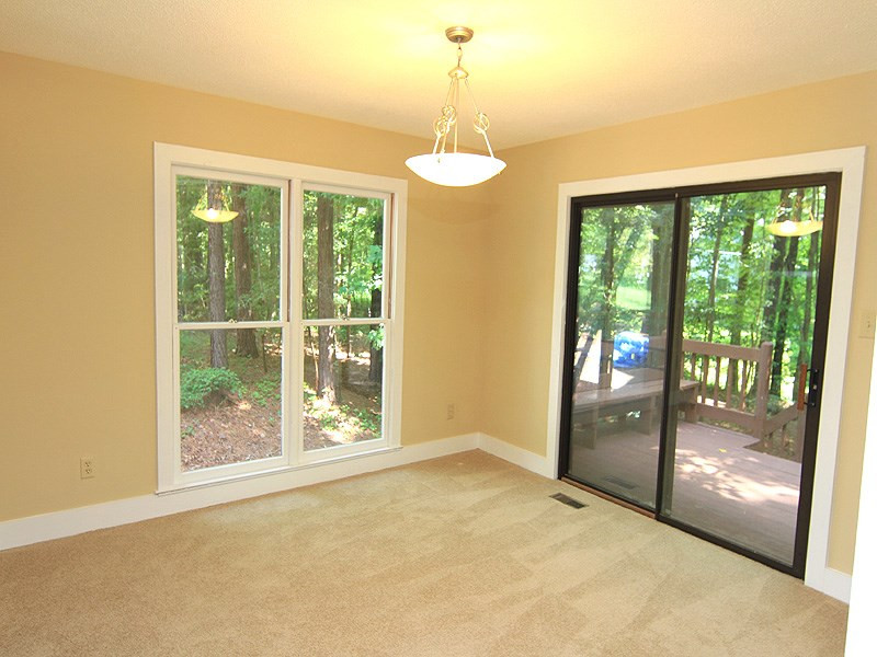 9 Strawberry Ridge Lane Durham, NC 27713 - Photo 9 of 17 Sliding doors from dining room to the large open deck. Dining room