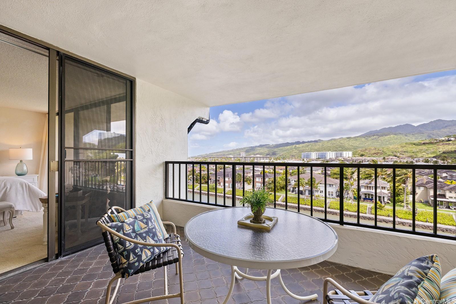 500 Lunalilo Home Road, Unit 16B Honolulu, HI 96825 - Photo 1 of 1 a balcony with table and chairs