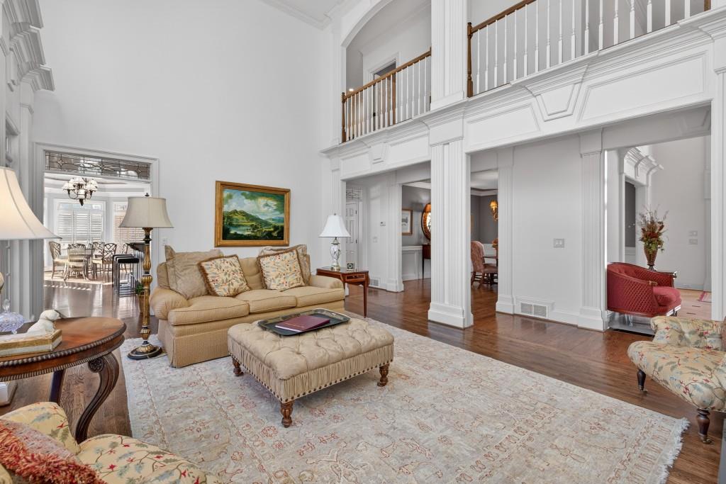2761 Calloway Court Duluth, GA 30097 - Photo 17 of 124 a living room with furniture and wooden floor