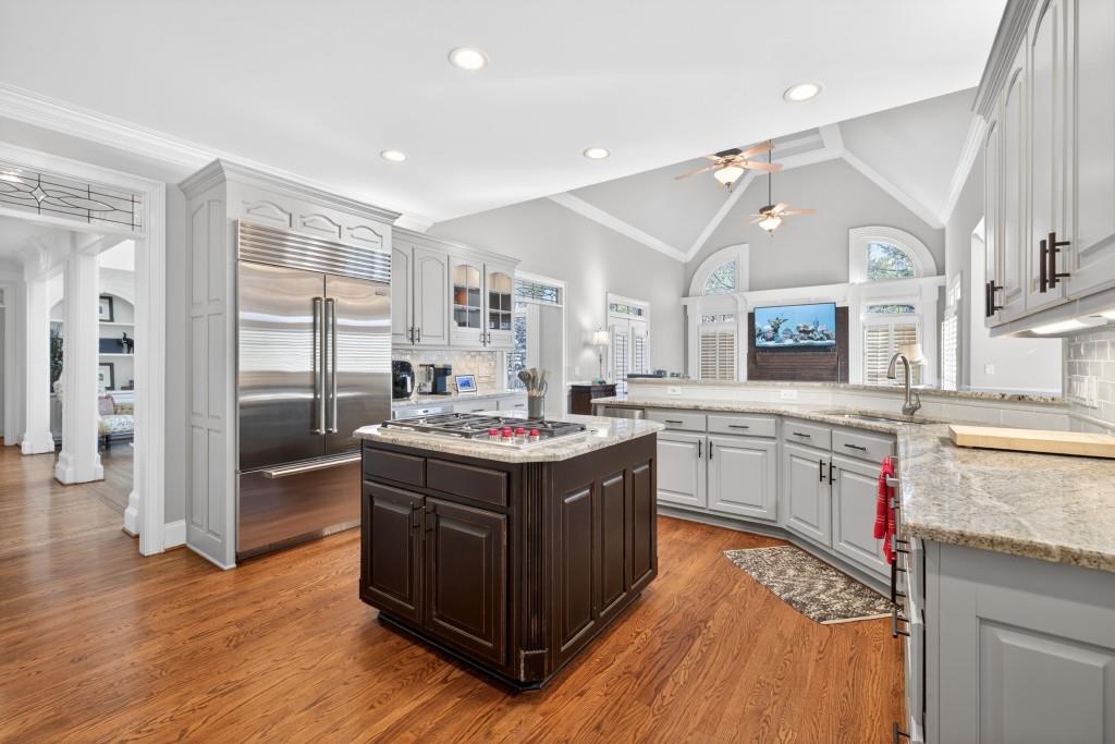 2761 Calloway Court Duluth, GA 30097 - Photo 23 of 124 a kitchen with stainless steel appliances granite countertop a stove and a sink