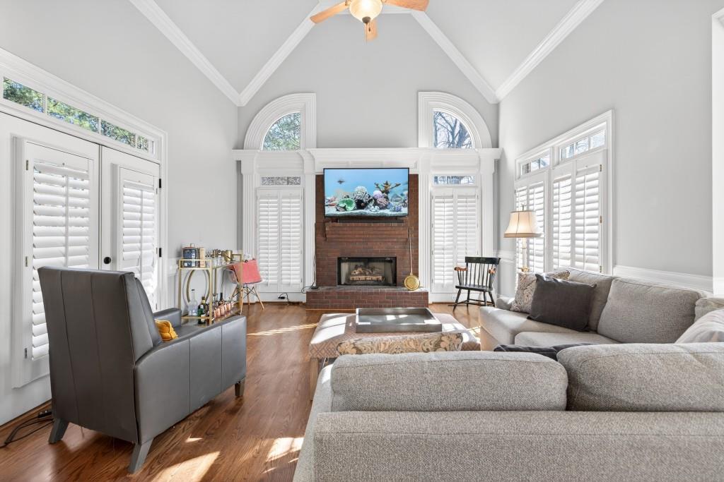 2761 Calloway Court Duluth, GA 30097 - Photo 28 of 124 a living room with furniture a large window and a fireplace