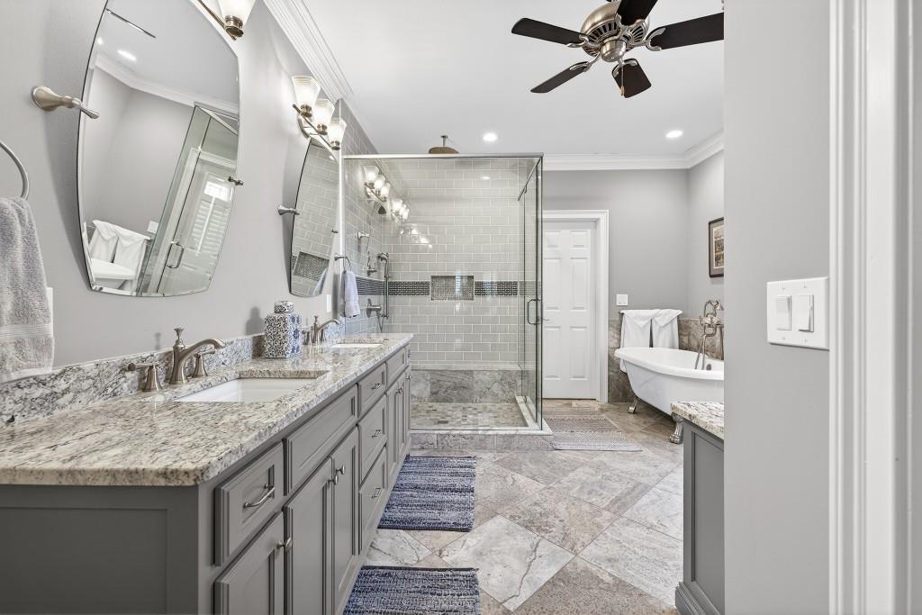 2761 Calloway Court Duluth, GA 30097 - Photo 41 of 124 a bathroom with a granite countertop sink a mirror and a shower