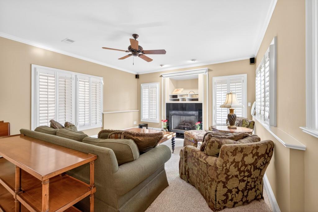 2761 Calloway Court Duluth, GA 30097 - Photo 68 of 124 a living room with furniture ceiling fan and a window