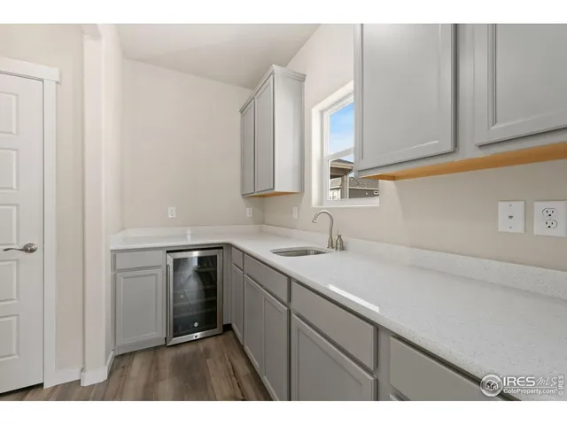 a kitchen with a sink cabinets and a window