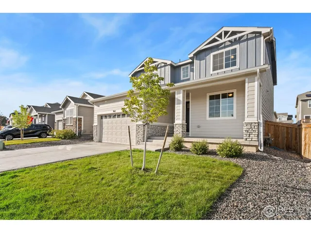 a view of a front of a house with a yard