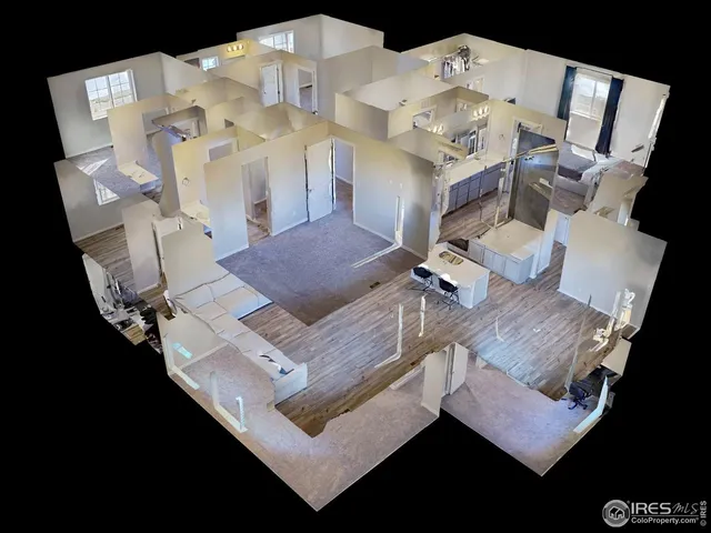 a view of living room with furniture and wooden floor