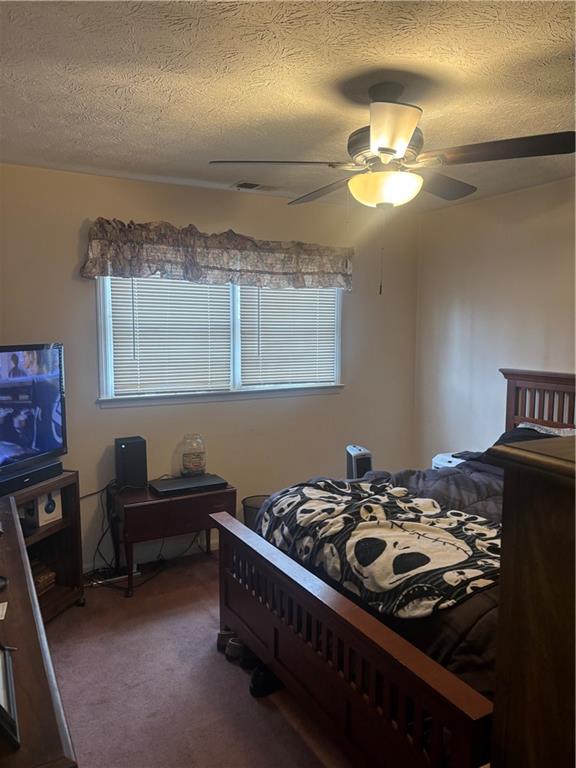 224 Abri Place Southwest Lilburn, GA 30047 - Photo 11 of 19 a bedroom with a bed and a chandelier