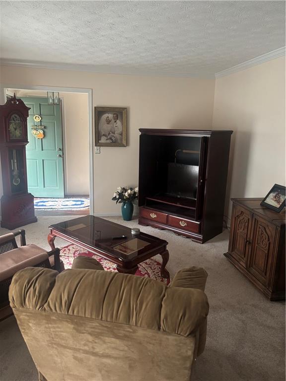 224 Abri Place Southwest Lilburn, GA 30047 - Photo 3 of 19 a living room with furniture and a flat screen tv