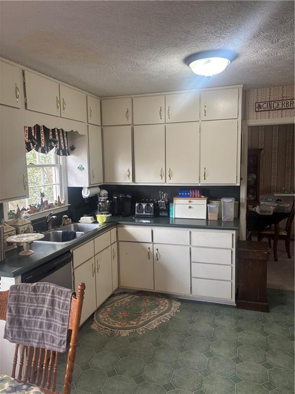 224 Abri Place Southwest Lilburn, GA 30047 - Photo 5 of 19 a kitchen with a sink and cabinets
