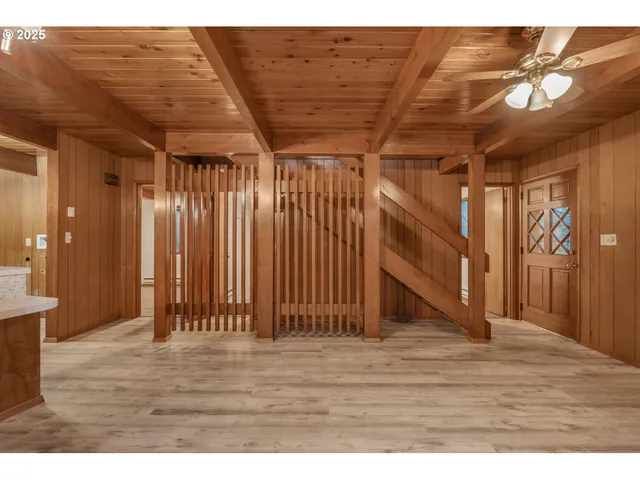 a view of a room with wooden walls