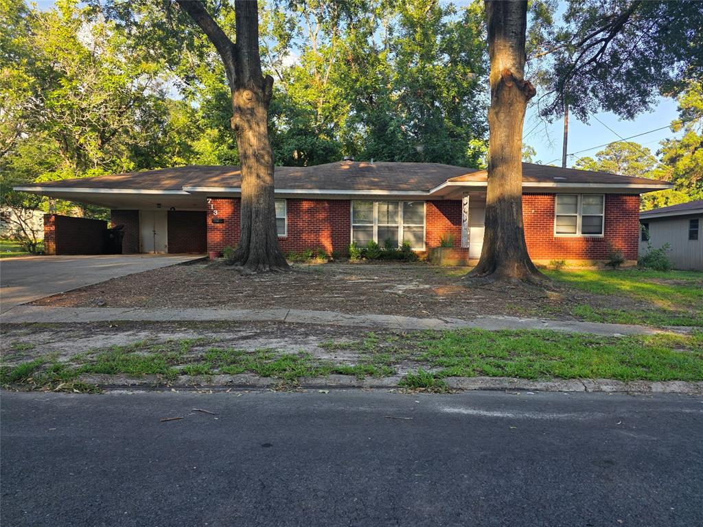 713 10th Street Northwest Springhill, LA 71075 - Photo 1 of 1 Ranch-style home with concrete driveway, brick siding, and an attached carport