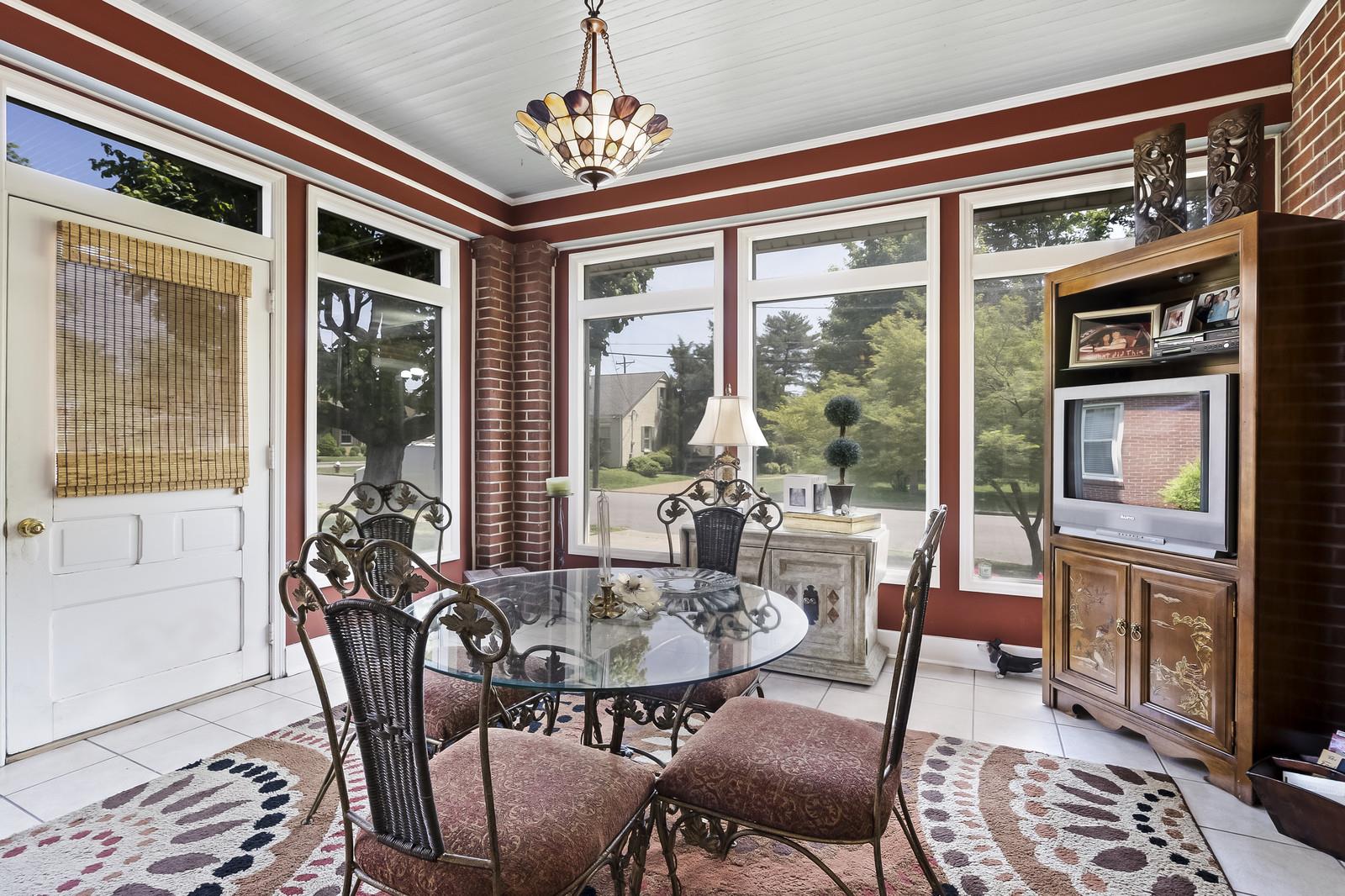 403 North Garner Street Springfield, TN 37172 - Photo 16 of 29 a view of a dining room with furniture large windows and wooden floor