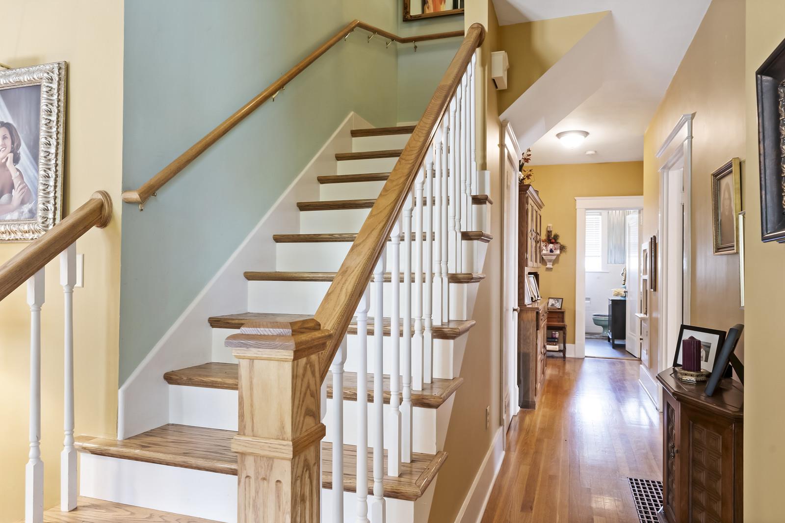 403 North Garner Street Springfield, TN 37172 - Photo 20 of 29 a view of staircase with lots of frames on wall and wooden floor
