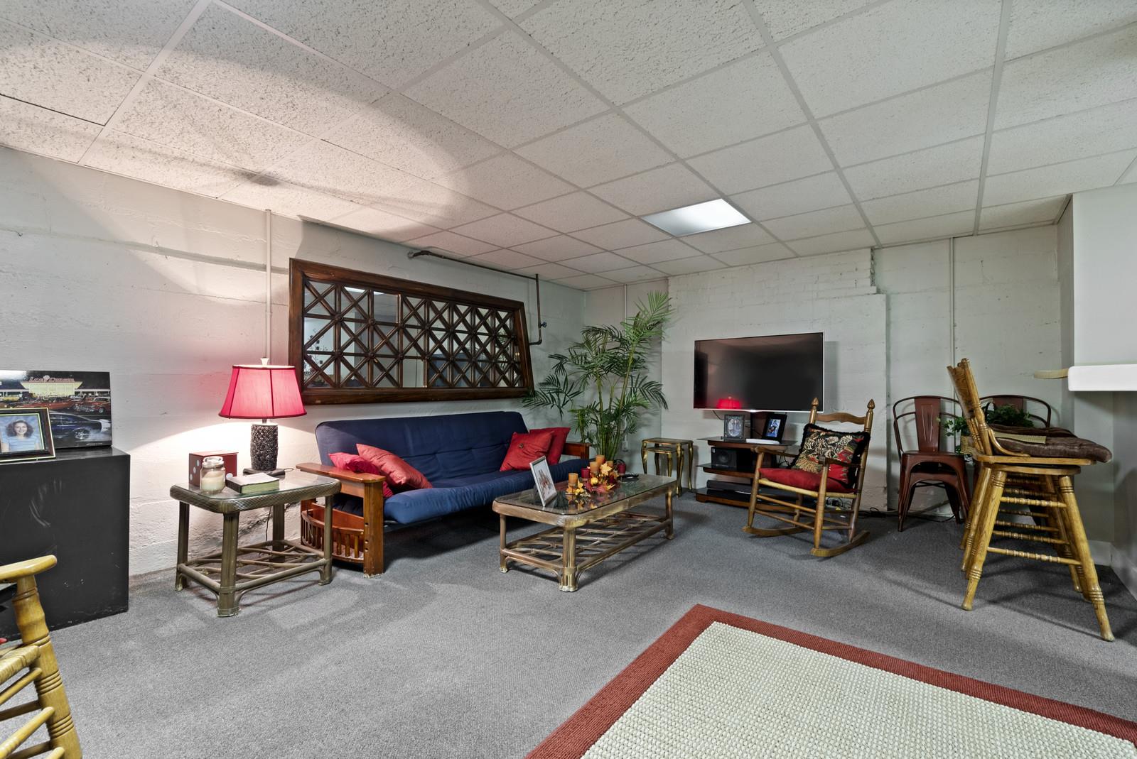 403 North Garner Street Springfield, TN 37172 - Photo 27 of 29 a living room with furniture a flat screen tv and a table