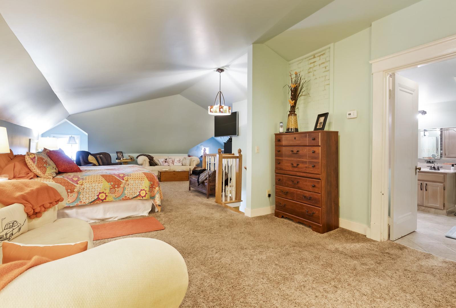 403 North Garner Street Springfield, TN 37172 - Photo 28 of 29 a bed room with a bed and a chair