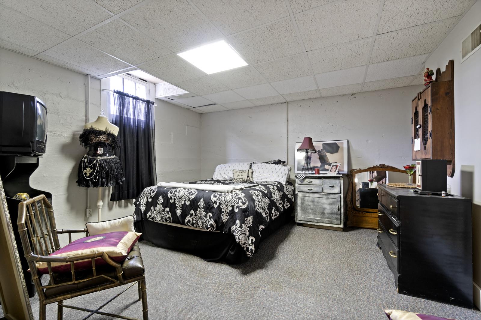403 North Garner Street Springfield, TN 37172 - Photo 29 of 29 a spacious bedroom with a bed and a tv