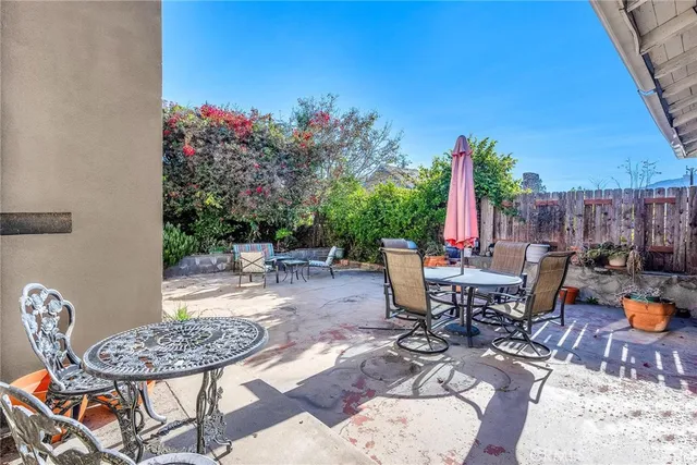 a view of a backyard with sitting area
