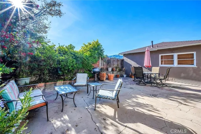 a view of a backyard with sitting area