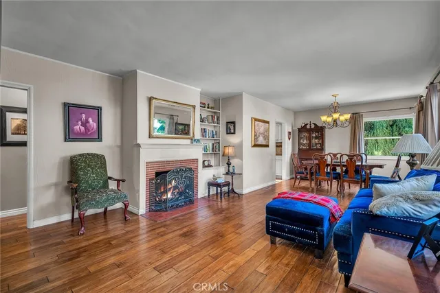 a living room with fireplace furniture and a fireplace