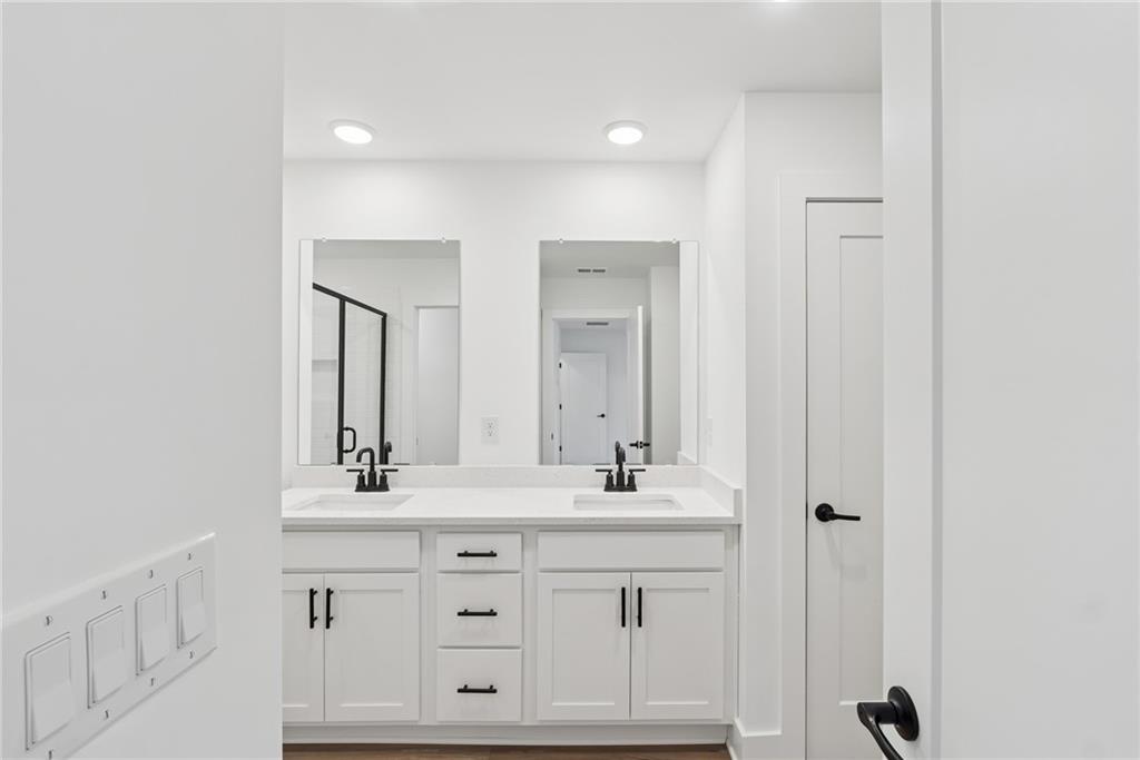 191 Redbud Road Canton, GA 30114 - Photo 11 of 15 a bathroom with a sink vanity and mirror