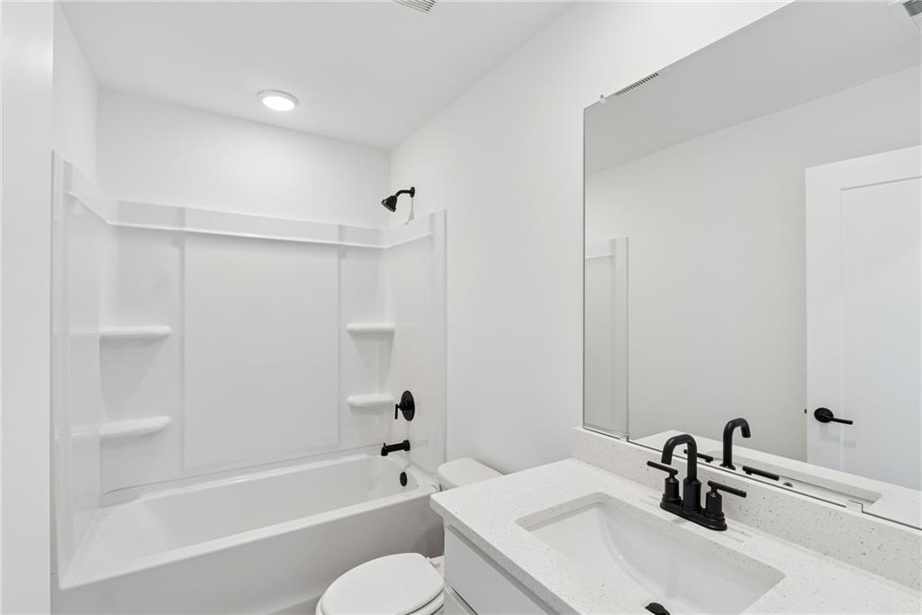 191 Redbud Road Canton, GA 30114 - Photo 12 of 15 a bathroom with a sink toilet and shower