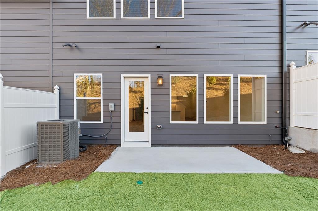 191 Redbud Road Canton, GA 30114 - Photo 2 of 15 a front view of a house with a yard
