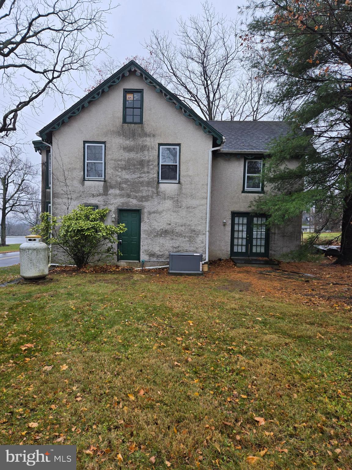 6 Township Line Road Line Lexington, PA 18932 - Photo 1 of 43 a front view of a house with a garden