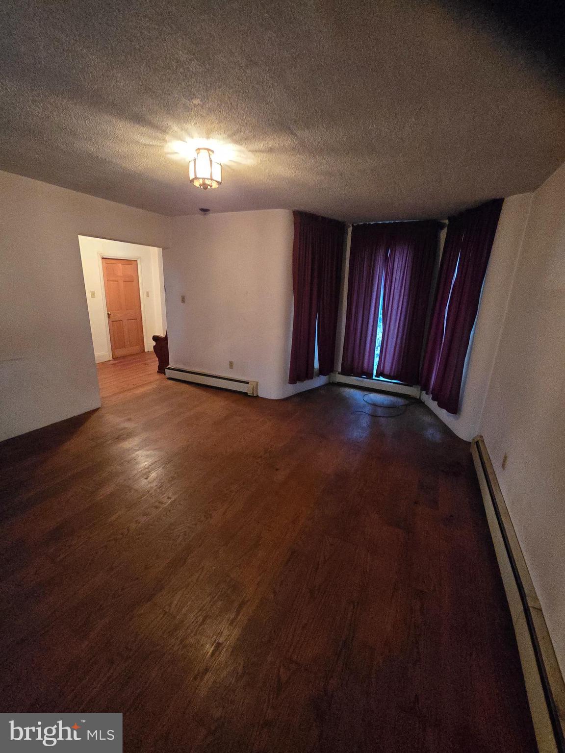 6 Township Line Road Line Lexington, PA 18932 - Photo 13 of 43 an empty room with wooden floor and windows
