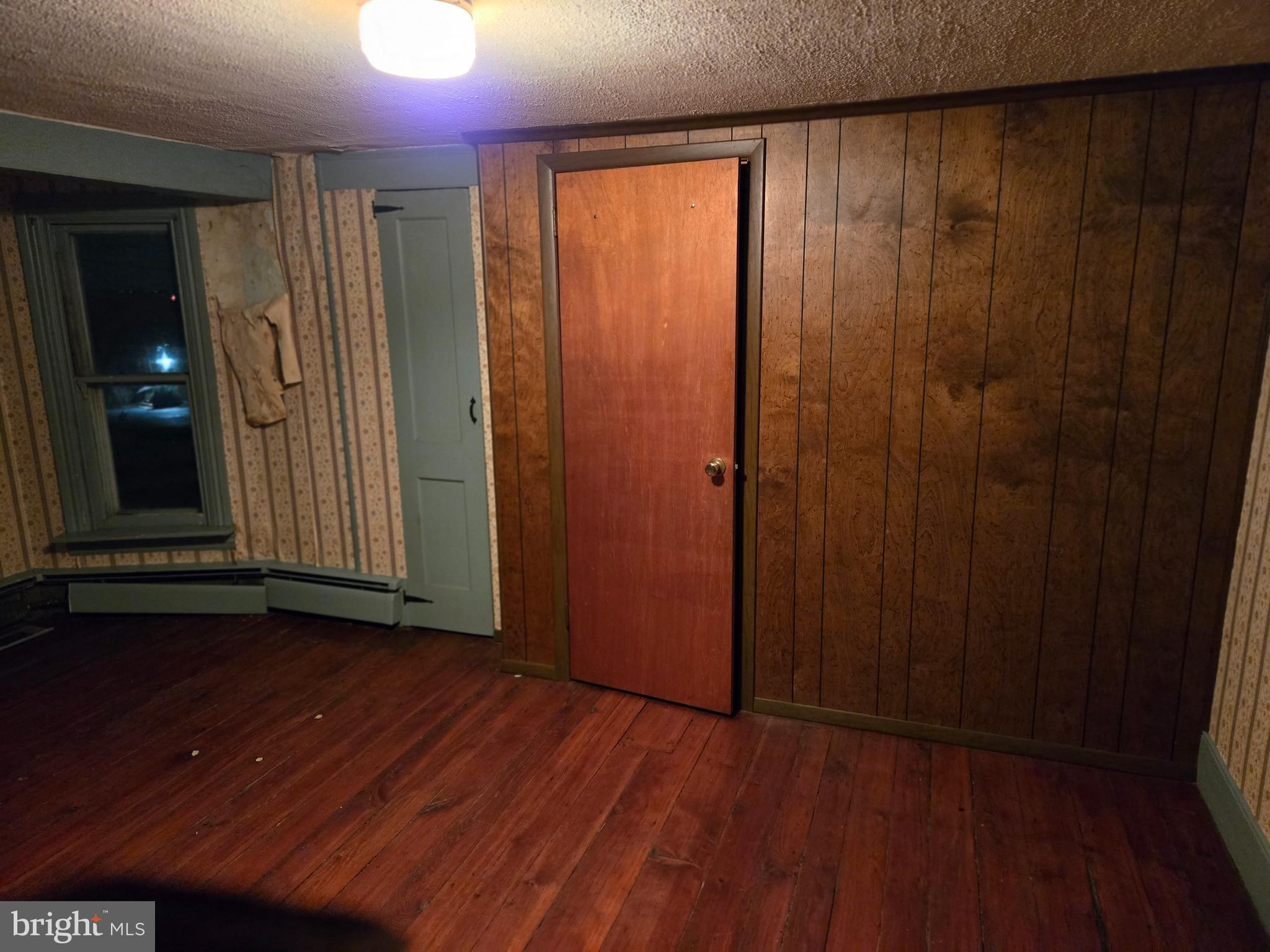6 Township Line Road Line Lexington, PA 18932 - Photo 22 of 43 an empty room with wooden floor and windows