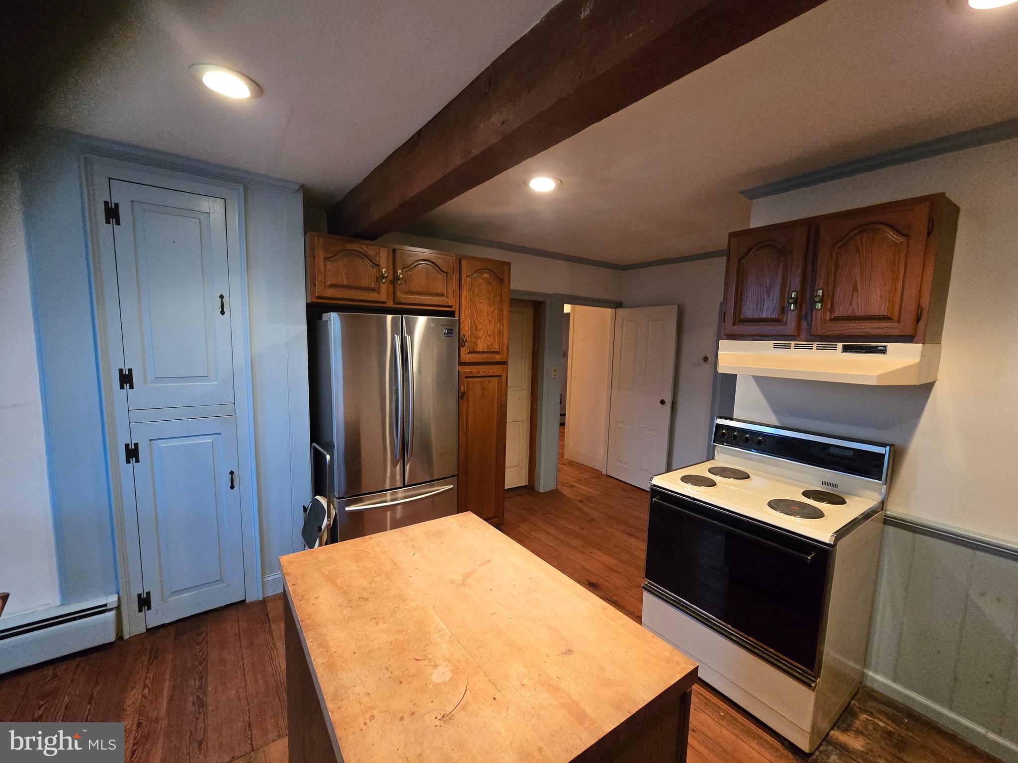 6 Township Line Road Line Lexington, PA 18932 - Photo 6 of 43 a kitchen with granite countertop cabinets stainless steel appliances and wooden floor