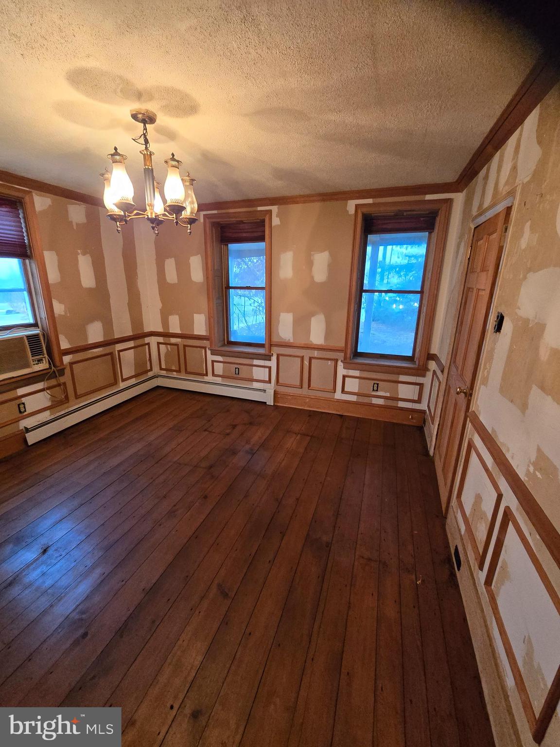6 Township Line Road Line Lexington, PA 18932 - Photo 9 of 43 a view of an empty room with wooden floor and a window