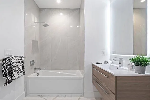 a bathroom with a bathtub and a sink