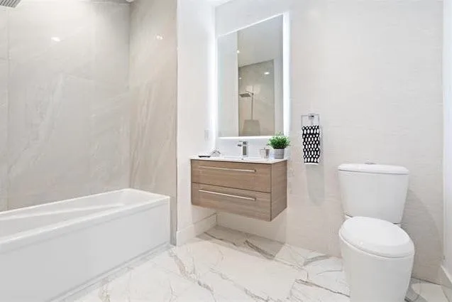 a bathroom with a sink a toilet and bathtub
