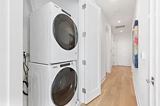 a view of a hallway with washer and dryer