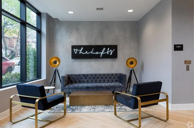 a living room with furniture and a table