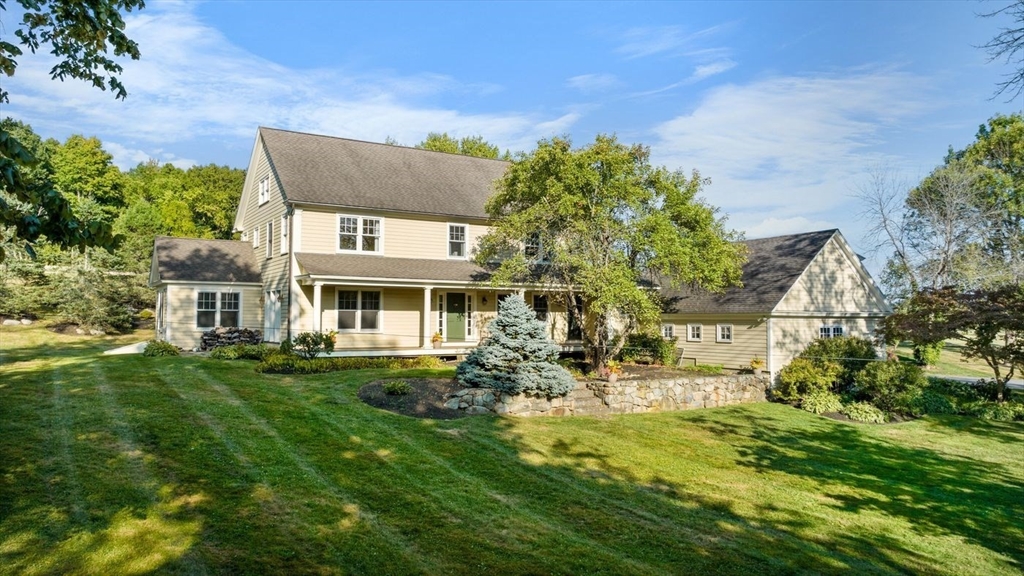 29 River Road Topsfield, MA 01983 - Photo 1 of 31 a front view of a house with a yard