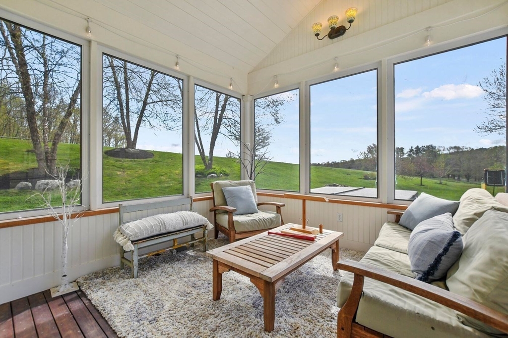 29 River Road Topsfield, MA 01983 - Photo 18 of 31 a living room with furniture and a large window