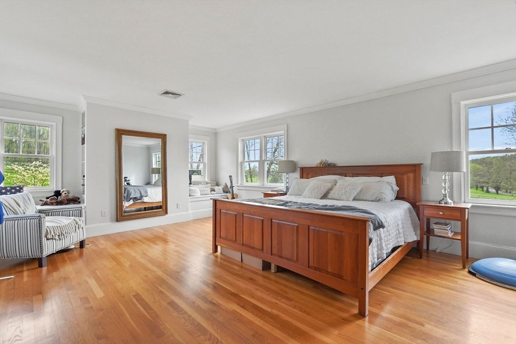 29 River Road Topsfield, MA 01983 - Photo 20 of 31 a spacious bedroom with a bed and large windows