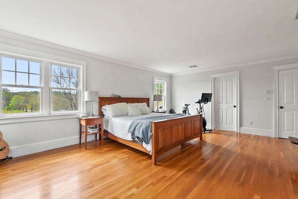 29 River Road Topsfield, MA 01983 - Photo 21 of 31 a bedroom with a bed and window