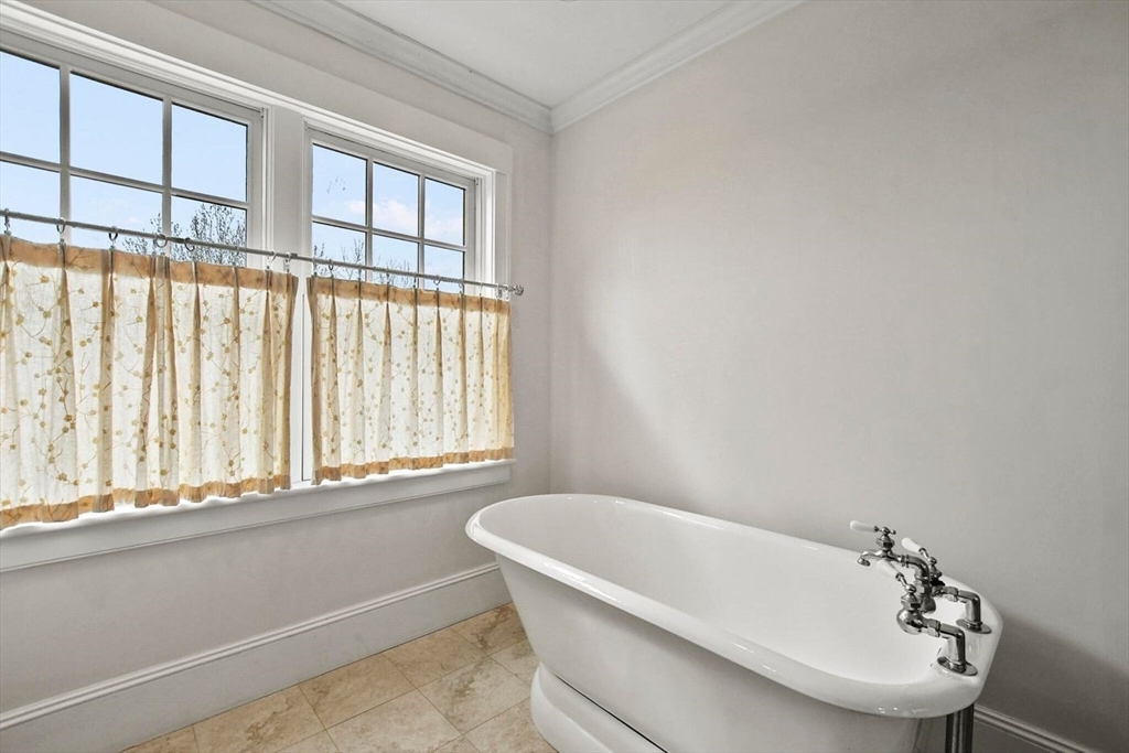 29 River Road Topsfield, MA 01983 - Photo 23 of 31 a bathroom with a bathtub and a sink