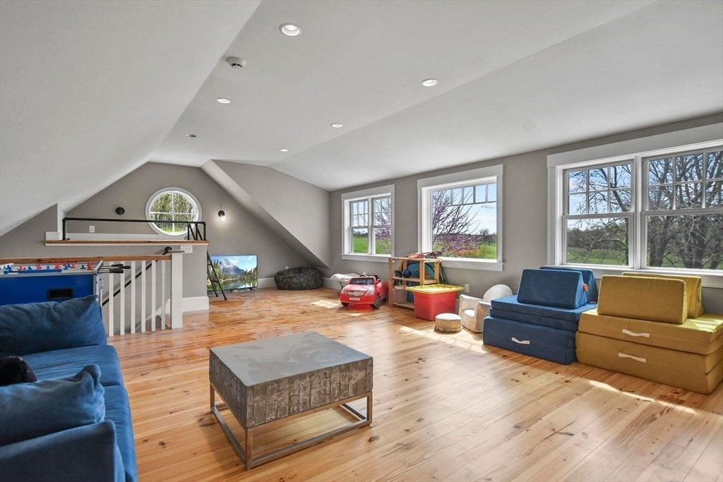 29 River Road Topsfield, MA 01983 - Photo 28 of 31 a living room with furniture and a large window
