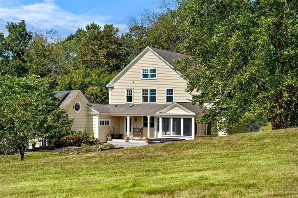 29 River Road Topsfield, MA 01983 - Photo 5 of 31 a front view of a house with a yard