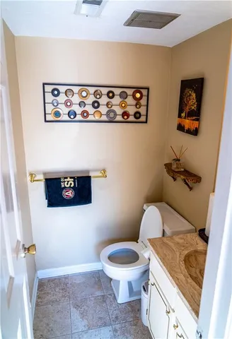 a bathroom with a toilet and a sink