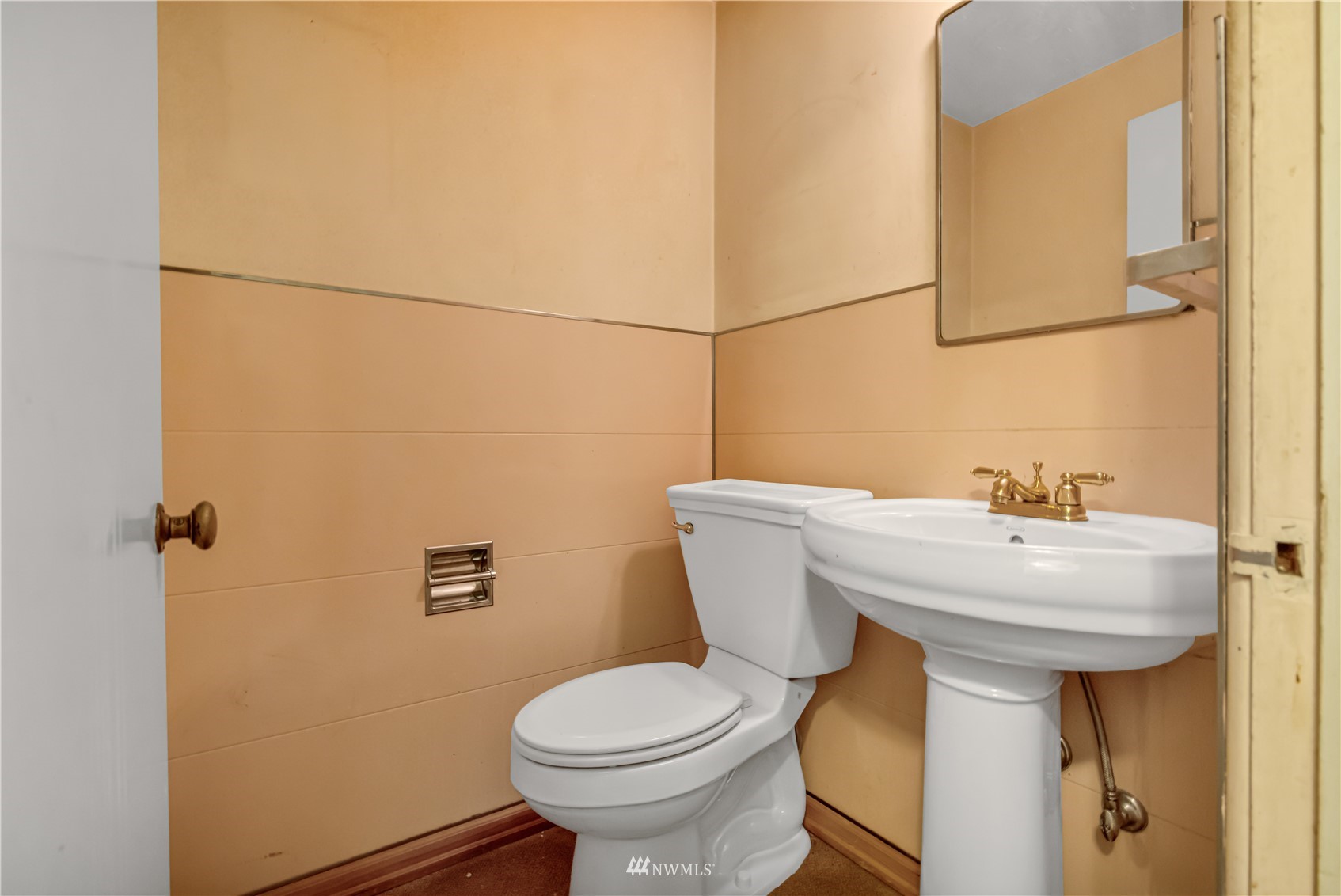 591 Pleasant Bay Road Bellingham, WA 98229 - Photo 13 of 40 a white toilet sitting next to a bathroom sink